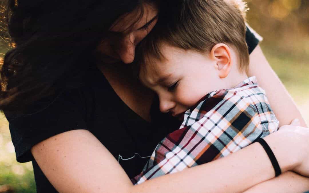 Woman holding her young son